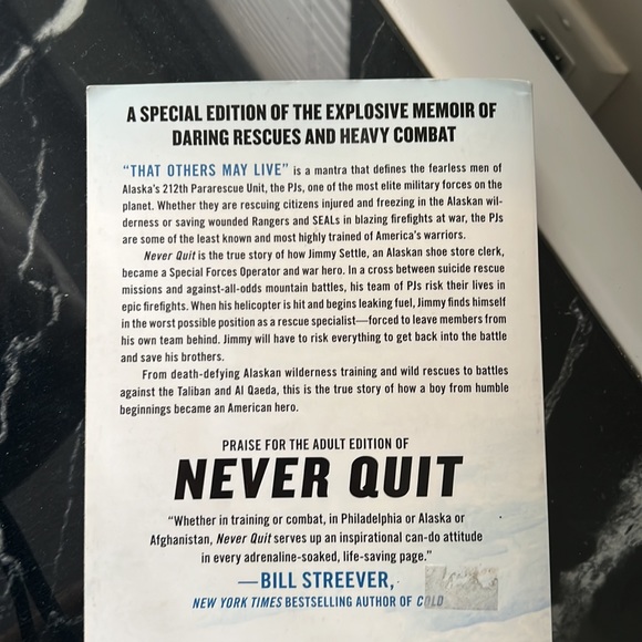 Never quit is the true story book of how a boy from humble beginnings bcm a hero - Picture 2 of 2